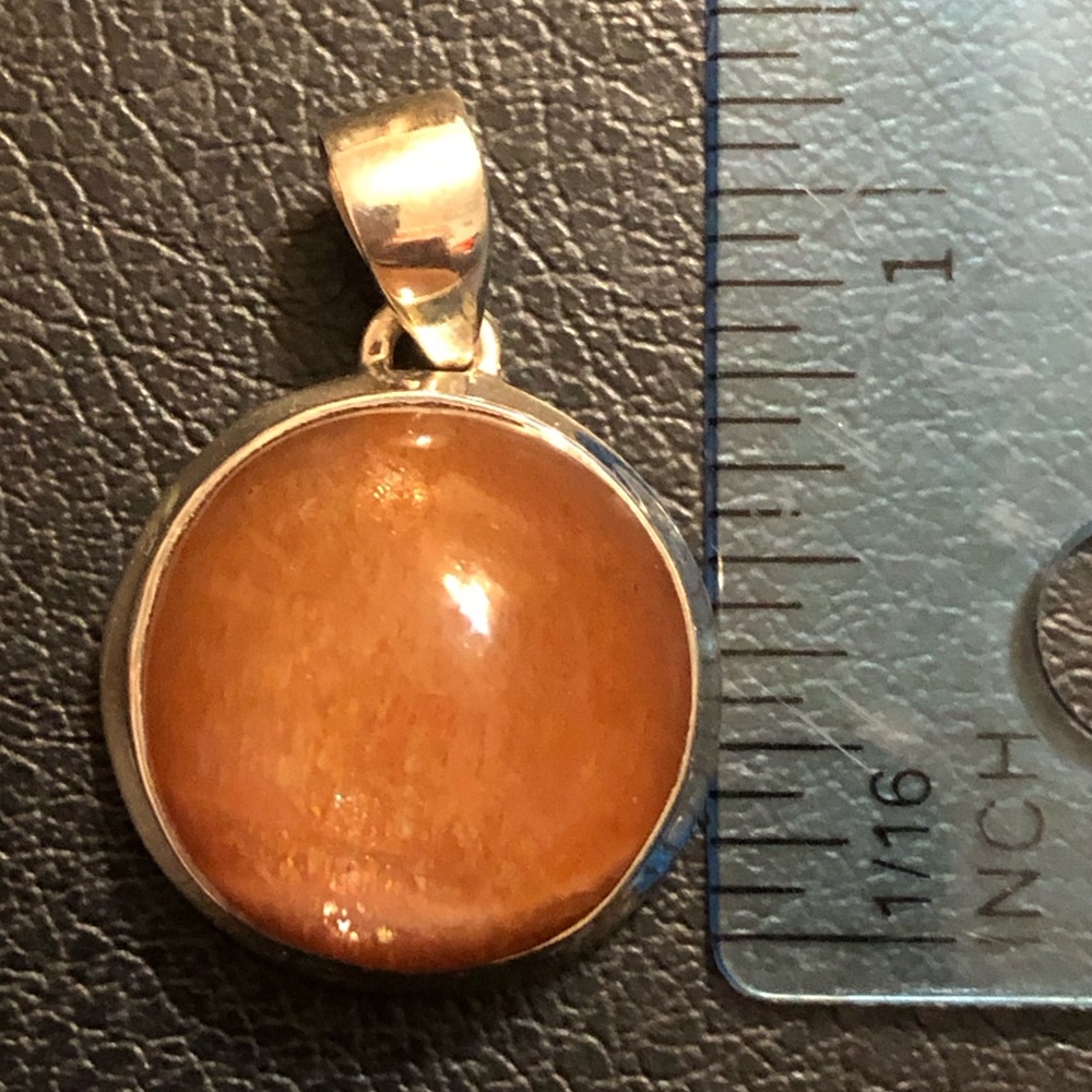 Sterling silver and genuine sunstone pendant